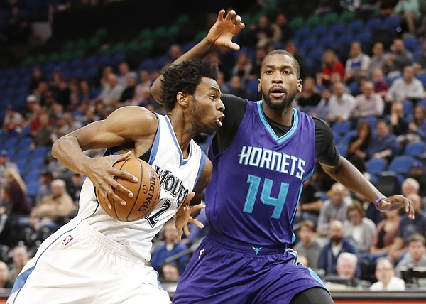Minnesota Timberwolves' Andrew Wiggins, left, drives on Charlotte Hornets' Michael Kidd-Gilchrist in the first quarter of an NBA basketball game Tuesday, Nov. 15, 2016, in Minneapolis. (AP Photo/Jim Mone)