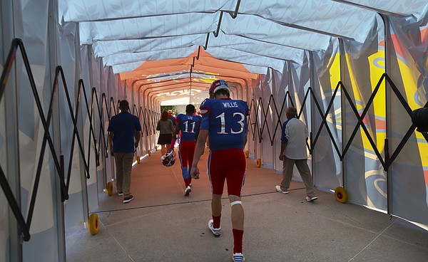 Kansas quarterback Ryan Willis (13) walks through the tunnel to the locker room following the Jayhawks' 24-23 heartbreaking loss to TCU on Saturday, Oct. 8, 2016 at Memorial Stadium.