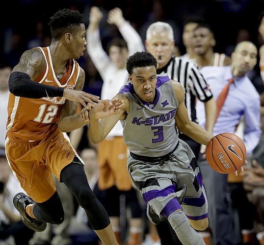 Kansas State's Kamau Stokes (3) is pressured by Texas' Kerwin Roach Jr. (12) during the second half of an NCAA college basketball game Friday, Dec. 30, 2016, in Manhattan, Kan. Kansas State won 65-62.