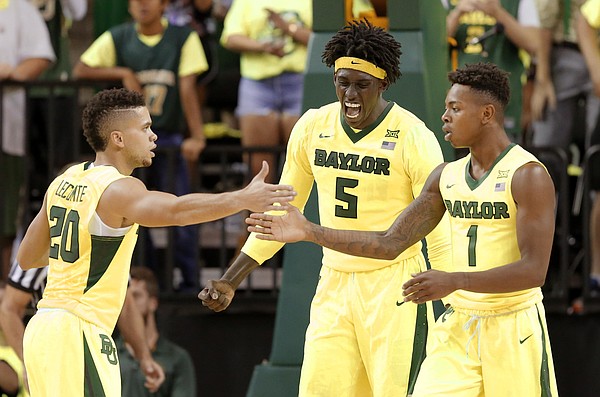 Baylor's Manu Lecomte (20), Wendell Mitchell (1) and Johnathan Motley (5) celebrate in the second half of an NCAA college basketball game against Oregon on Tuesday Nov. 15, 2016, in Waco, Texas.
