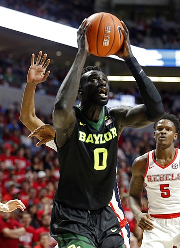 Baylor's Jo Lual-Acuil Jr., (0) takes an uncontested shot at the basket against Mississippi in the first half of an NCAA college basketball game in Oxford, Miss., Saturday, Jan. 28, 2017.