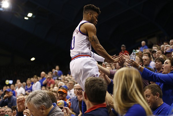 Kansas guard Frank Mason III (0) goes into the seats trying to save a ball during the first half, Wednesday, Feb. 1, 2017 at Allen Fieldhouse.