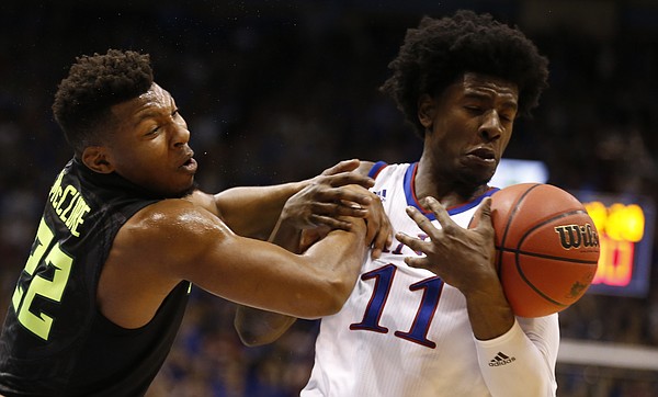 Kansas guard Josh Jackson (11) comes away with a  ball from Baylor guard King McClure (22) during the second half, Wednesday, Feb. 1, 2017 at Allen Fieldhouse.