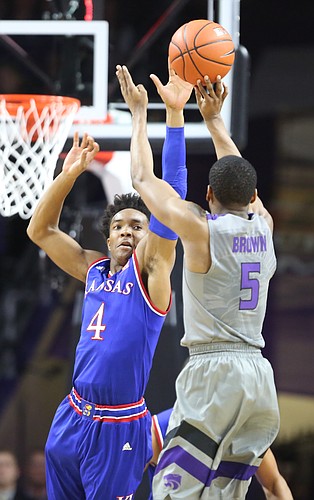 Kansas guard Devonte' Graham (4) defends against a shot from Kansas State guard Barry Brown (5) during the first half, Monday, Feb. 6, 2017 at Bramlage Coliseum.