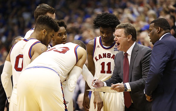 Kansas head coach Bill Self pulls in the Jayhawks for a huddle with seconds remaining in overtime, Monday, Feb. 13, 2017 at Allen Fieldhouse.