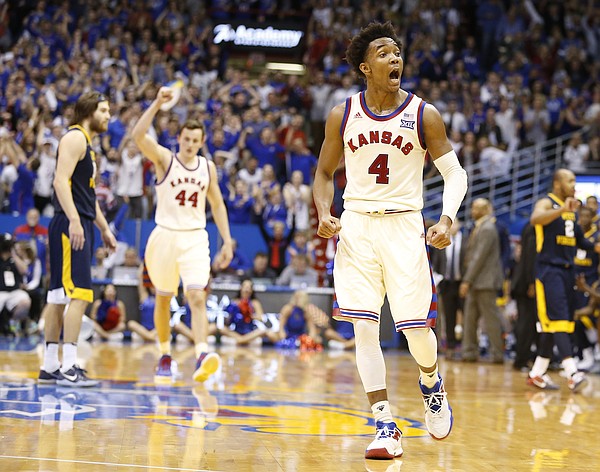 Kansas guard Devonte' Graham (4) gets fired up as the Jayhawks close in on the West Virginia lead during the second half, Monday, Feb. 13, 2017 at Allen Fieldhouse.