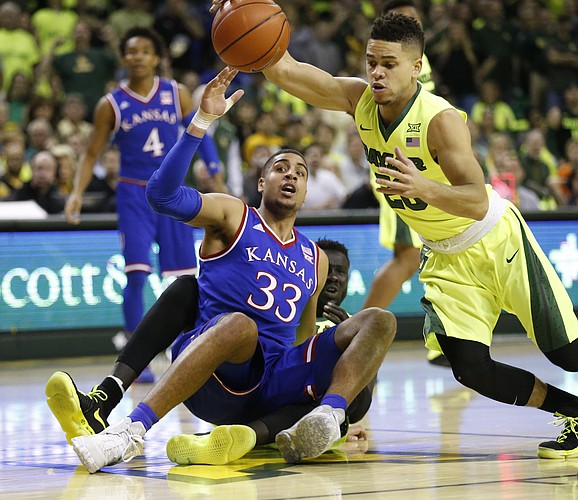 Baylor guard Manu Lecomte (20) comes away with a ball from Kansas forward Landen Lucas (33) who is called for a foul during the first half, Saturday, Feb. 18, 2017 at Ferrell Center in Waco, Texas.