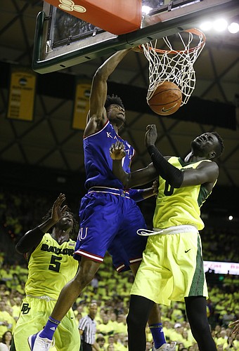 Kansas guard Josh Jackson (11) drills home a dunk over Baylor forward Jo Lual-Acuil Jr. (0) during the second half, Saturday, Feb. 18, 2017 at Ferrell Center in Waco, Texas.