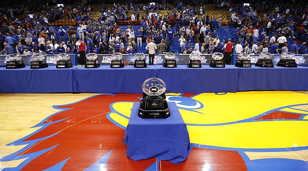 The Jayhawks' 13-straight Big 12 conference trophies are lined up along the court, Wednesday, Feb. 22, 2017 at Allen Fieldhouse.