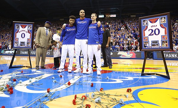 Kansas seniors Frank Mason III, left, Landen Lucas and Tyler Self come together for a photograph during the senior introductions on Monday, Feb. 27, 2017.