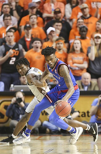 Kansas guard Lagerald Vick (2) steals a ball from Oklahoma State guard Brandon Averette (0) during the first half, Saturday, March 4, 2017 at Gallagher-Iba Arena. 