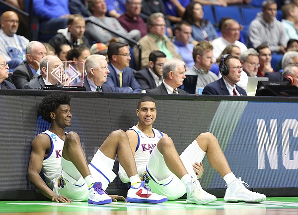 Kansas guard Josh Jackson, left, and Kansas forward Landen Lucas have a laugh while waiting to check in during the second half on Friday, March 17, 2017 at BOK Center in Tulsa, Oklahoma.