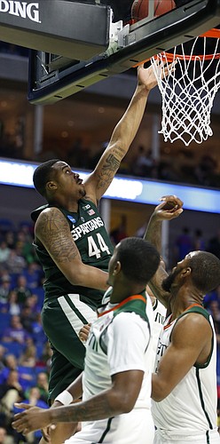 Michigan State forward Nick Ward (44) gets a bucket against Miami during the second half on Friday, March 17, 2017 at BOK Center in Tulsa, Oklahoma.