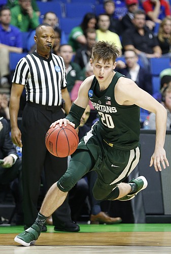 Michigan State guard Matt McQuaid (20) drives to th bucket during the second half on Friday, March 17, 2017 at BOK Center in Tulsa, Oklahoma.
