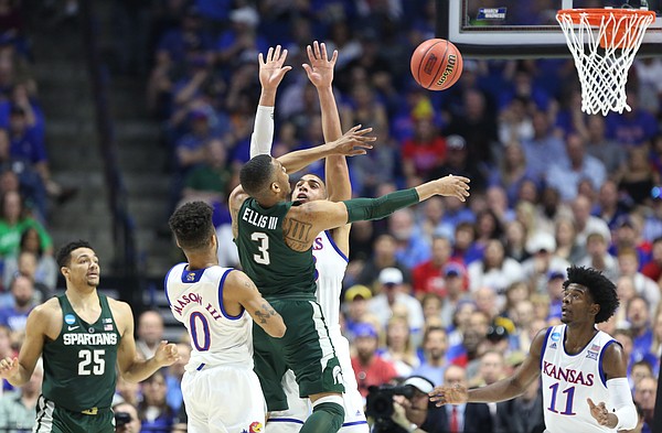 Michigan State guard Alvin Ellis III (3) loses the ball while defended by Kansas forward Landen Lucas (33) during the first half on Sunday, March 19, 2017 at BOK Center in Tulsa, Okla.