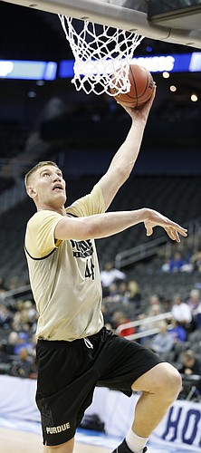 Purdue center Isaac Haas (44) hooks in a shot during a day of practices and press conferences prior to Thursday's game at Sprint Center in Kansas City, Mo.