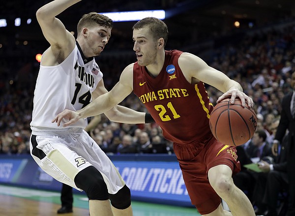 Iowa State's Matt Thomas (21) drives against Purdue's Ryan Cline (14) during the first half of an NCAA college basketball tournament second-round game Saturday, March 18, 2017, in Milwaukee.