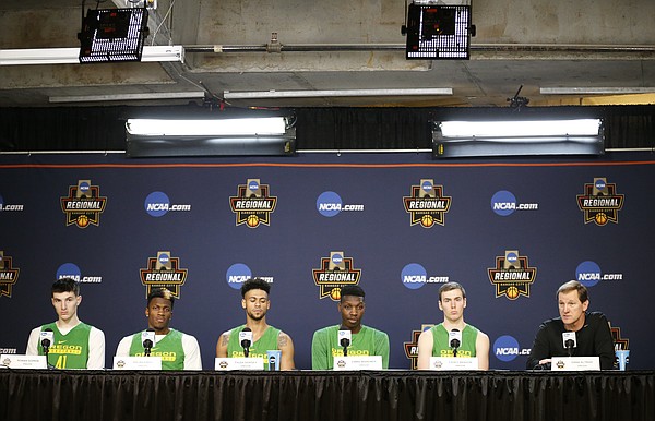 Oregon forward Roman Sorkin, left, guard Dylan Ennis, guard Tyler Dorsey, forward Chris Boucher, guard Casey Benson (2) and head coach Dana Altman talk with media members during a press conference on Friday, March 24, 2017 at Sprint Center.