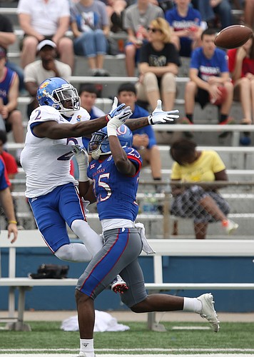 Team Jayhawks receiver Daylon Charlot has a pass broken up by Team KU cornerback Julian Chandler (25) during the first quarter of the 2017 Spring Game on Saturday, April 15 at Memorial Stadium.