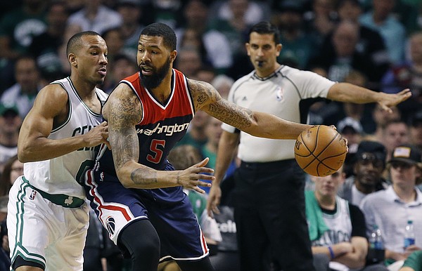 Boston Celtics' Avery Bradley (0) defends against Washington Wizards' Markieff Morris (5) during the first quarter of a second-round NBA playoff series basketball game, Sunday, April, 30, 2017, in Boston. (AP Photo/Michael Dwyer)