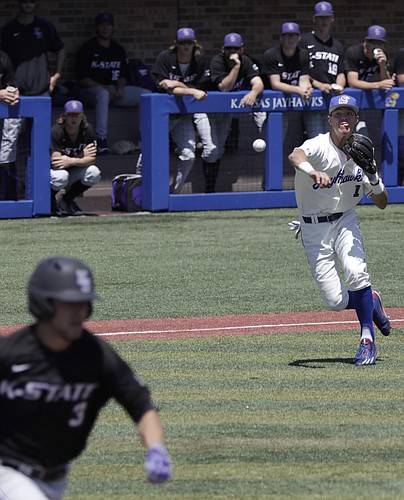After fielding a bunt down the third base line, Kansas infielder Benjamin Sems throws to first base for an out during the Jayhawks game Saturday, May 13 against the Kansas State Wildcats. 