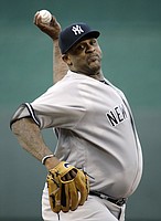 New York Yankees pitcher C.C. Sabathia delivers a pitch against the Kansas City Royals.