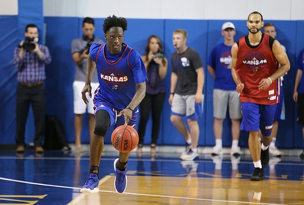 Blue Team guard Marcus Garrett brings the ball up the court during a scrimmage on Wednesday, June 7, 2017 at the Horejsi Family Athletics Center.