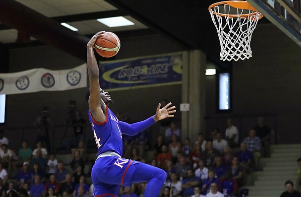 Kansas guard Malik Newman goes up for a dunk in an exhibition game between KU and Italy All Star A2, in Seregno, near Milan, Italy, Sunday, Aug. 6, 2017. 