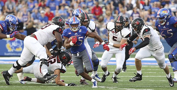 Kansas running back Dom Williams (25) breaks away from the Redhawks defense during the second quarter on Saturday, Sept. 2, 2017 at Memorial Stadium.