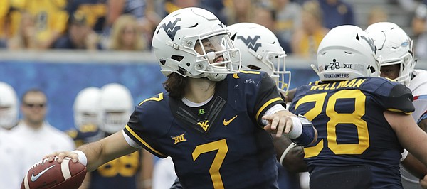 West Virginia quarterback Will Grier (7) attempts a pass during the second half of an NCAA college football game against Delaware State, Saturday, Sept. 16, 2017, in Morgantown, W.Va. (AP Photo/Raymond Thompson)