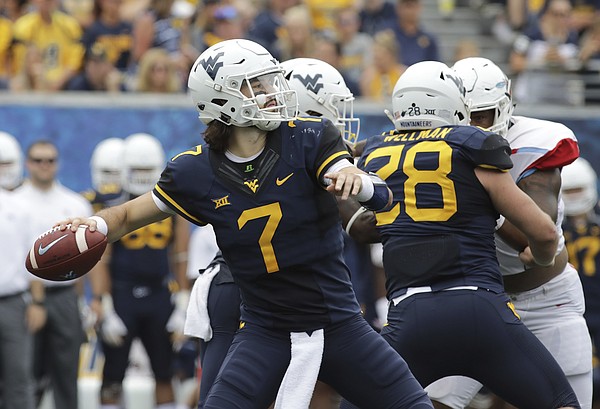 West Virginia quarterback Will Grier (7) attempts a pass during the second half of an NCAA college football game against Delaware State, Saturday, Sept. 16, 2017, in Morgantown, W.Va.