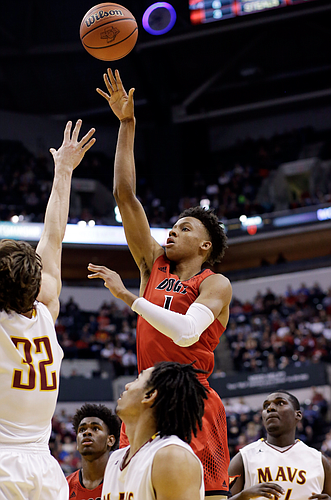 New Albany guard Romeo Langford (1) shoots over McCutcheon forward Haden Deaton (32) in the second half of the Indiana Class 4A IHSAA state championship basketball game in Indianapolis, Saturday, March 26, 2016. New Albany won 62-59. (AP Photo/AJ Mast)

