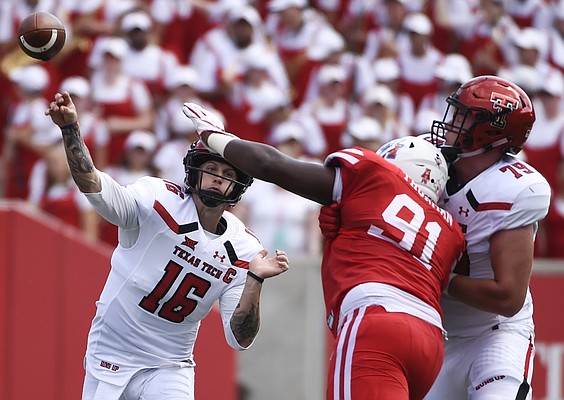 Texas Tech quarterback Nic Shimonek (16) throws a pass over Houston defensive end Nick Thurman (91) during the first half of an NCAA college football game, Saturday, Sept. 23, 2017, in Houston. (AP Photo/Eric Christian Smith)