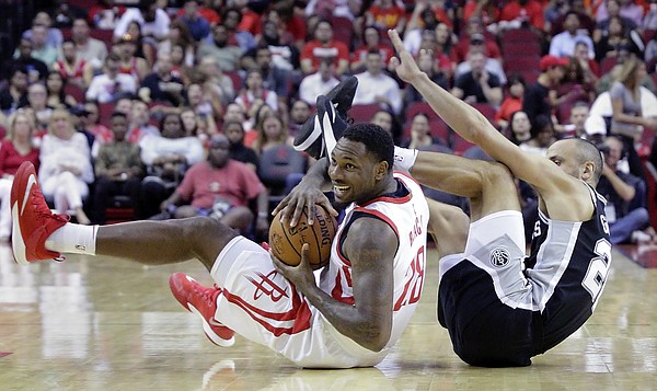 Houston Rockets forward Tarik Black (28) comes up with control of a loose ball against San Antonio Spurs guard Manu Ginobili (20) in the first half of an NBA preseason basketball game Friday, Oct. 13, 2017, in Houston. (AP Photo/Michael Wyke)