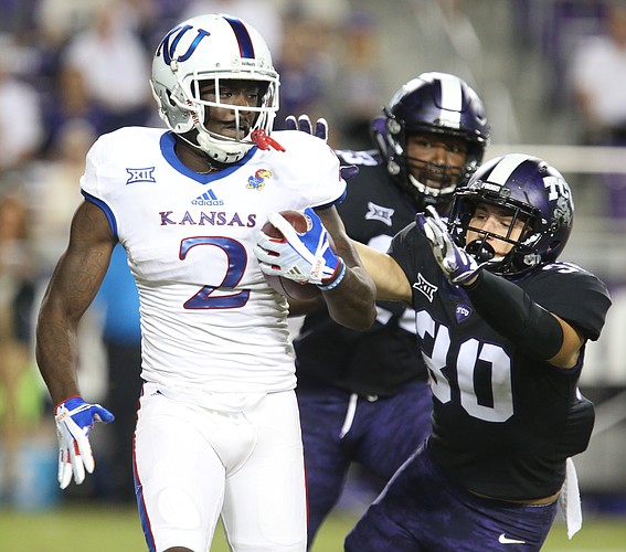 Kansas special teams player Daylon Charlot (2) is pursued by TCU special teams player Garret Wallow (30) during the fourth quarter, Saturday, Oct. 21, 2017 at Amon G. Carter Stadium in Fort Worth.