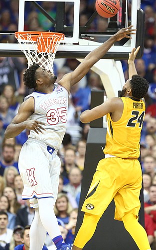 Kansas center Udoka Azubuike (35) defends against a shot from Missouri forward Kevin Puryear (24) during the first half of the Showdown for Relief exhibition, Sunday, Oct. 22, 2017 at Sprint Center in Kansas City, Missouri.