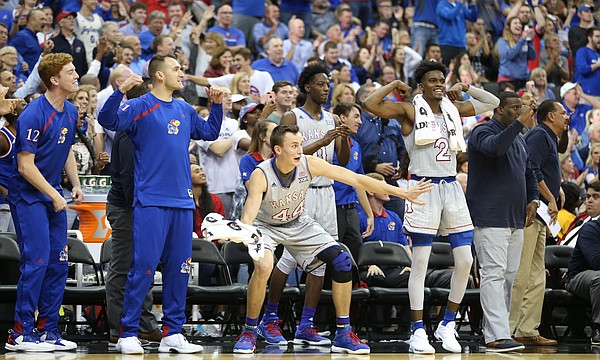 The Kansas bench reacts to a dunk by center Udoka Azubuike during the second half of the Showdown for Relief exhibition, Sunday, Oct. 22, 2017 at Sprint Center in Kansas City, Missouri.