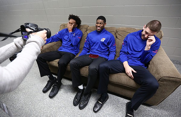 Kansas guards Devonte' Graham, left, and Sviatoslav Mykhailiuk, right, laugh as Malik Newman conducts an interview with a KU Athletics staff member during Big 12 Media Day, Tuesday, Oct. 24, 2017 at Sprint Center in Kansas City, Mo.