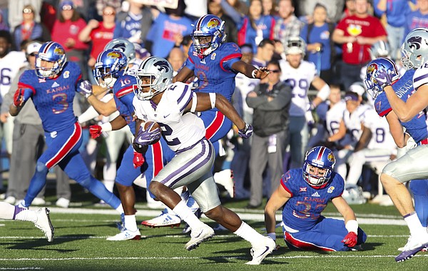 Kansas State kickoff returner D.J. Reed (2) escapes several Kansas special teams players during the fourth quarter on Saturday, Oct. 28, 2017 at Memorial Stadium.