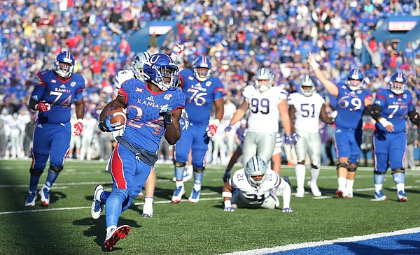 Kansas running back Taylor Martin (24) runs in a touchdown during the fourth quarter on Saturday, Oct. 28, 2017 at Memorial Stadium.