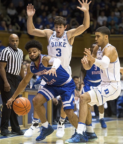 Tennessee State's Delano Spencer (1) loses the ball as Duke's Grayson Allen (3) and Duke's Jayson Tatum (0) defend during the first half of an NCAA college basketball game in Durham, N.C., Monday, Dec. 19, 2016. 