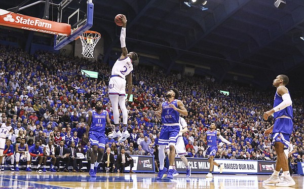 Kansas guard Lagerald Vick (2) floats in for a dunk during the first half on Friday, Nov. 10, 2017 at Allen Fieldhouse.