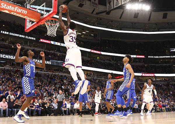 Kansas center Udoka Azubuike (35) gets up for a lob jam against Kentucky during the second half on Tuesday, Nov. 14, 2017 at United Center.