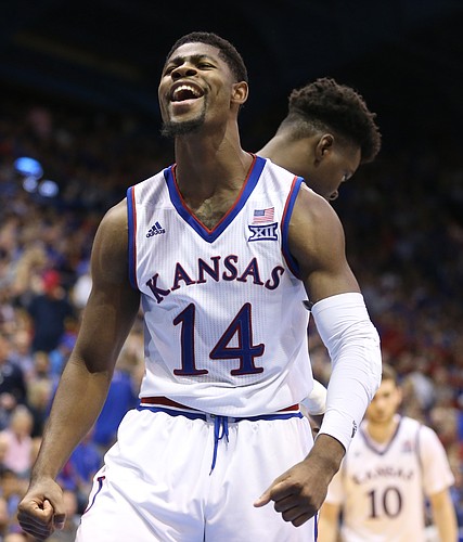 Kansas guard Malik Newman (14) roars after an and-one bucket during the second half on Friday, Nov. 24, 2017 at Allen Fieldhouse.