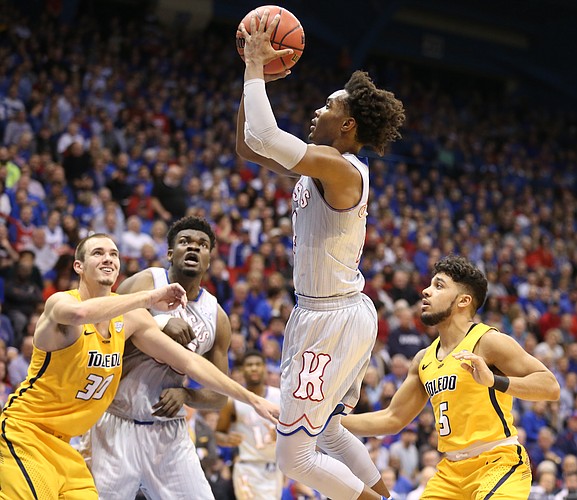 Kansas guard Devonte' Graham hangs for a shot during the first half on Tuesday, Nov. 28, 2017 at Allen Fieldhouse.