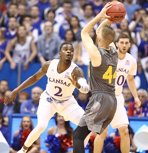 Kansas guard Lagerald Vick (2) looks to swipe the ball from Arizona State guard Kodi Justice (44) during the first half, Sunday, Dec. 10, 2017 at Allen Fieldhouse.