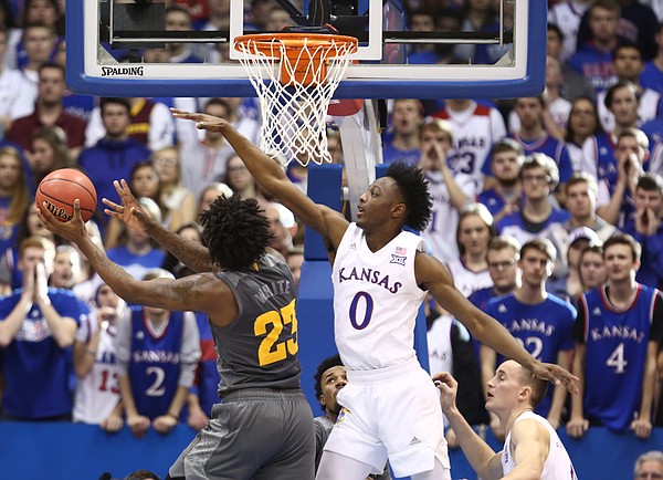 Arizona State forward Romello White (23) gets a shot after a foul from Kansas guard Marcus Garrett (0) during the second half, Sunday, Dec. 10, 2017 at Allen Fieldhouse.