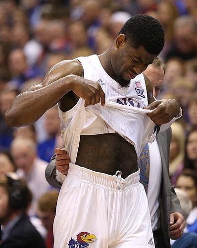 Kansas guard Malik Newman (14) leaves the game with a  concussion during the second half, Sunday, Dec. 10, 2017 at Allen Fieldhouse.