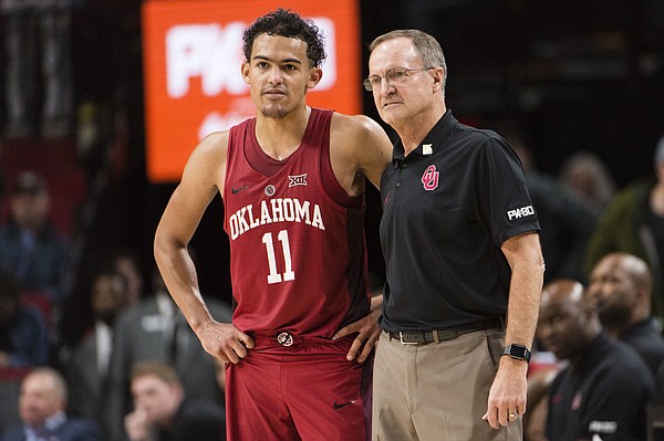 Oklahoma guard Trae Young stands with head coach Lon Kruger during the second half in an NCAA college basketball game against Arkansas during the Phil Knight Invitational Tournament, in Portland, Ore., Thursday, Nov. 23, 2017. (AP Photo/Troy Wayrynen)