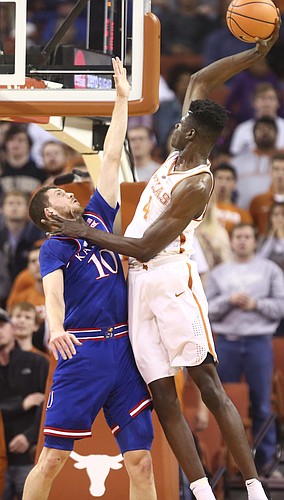 Texas forward Mohamed Bamba (4) pulls back for an attempted dunk over Kansas guard Sviatoslav Mykhailiuk (10) during the first half on Friday, Dec. 29, 2017 at Frank Erwin Center in Austin, Texas.